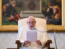 Pope Francis gives a general audience address in the library of the Apostolic Palace.