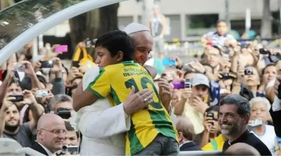 Nathan de Brito hugs Pope Francis during his visit to Rio de Janeiro for World Youth Day 2013.?w=200&h=150