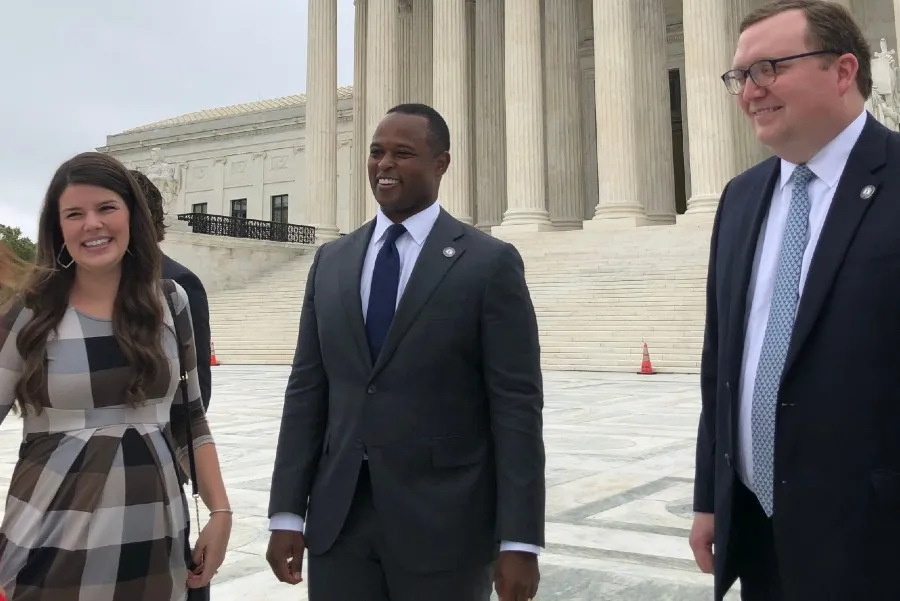 Matthew Kuhn, Principal Deputy Solicitor General of Kentucky (right), along with Daniel Cameron, Attorney General of Kentucky (center) and his wife Makenze (left), outside the U.S. Supreme Court on Oct. 12, 2021.?w=200&h=150