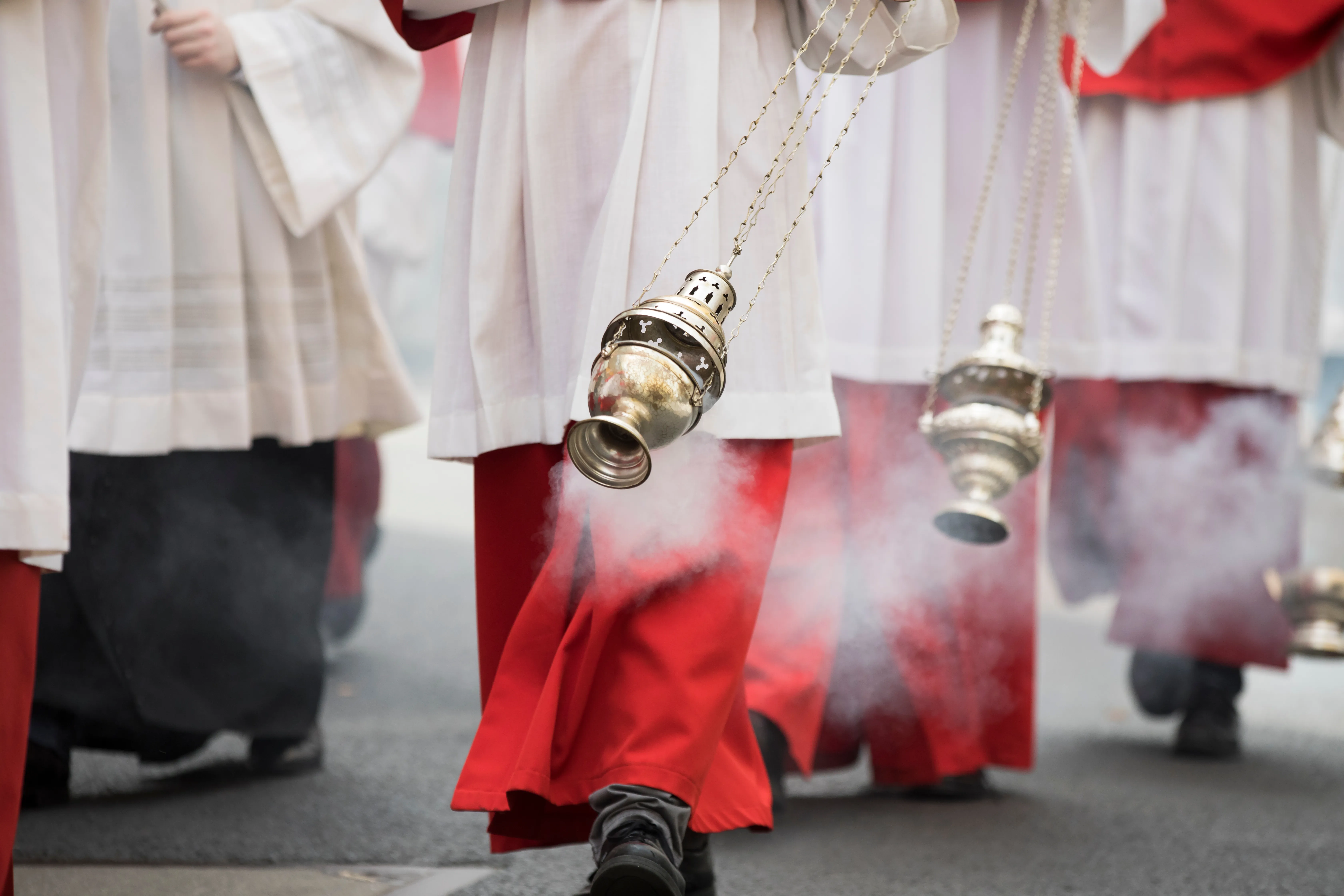 Altar boys swing incense in a procession in Cologne, Germany.?w=200&h=150