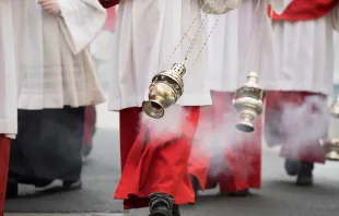 Altar boys swing incense in a procession in Cologne, Germany. Shutterstock