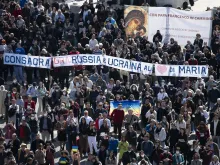 Banner calling for the consecration of Russia is displayed during Pope Francis' Angelus in St. Peter's Square on March 13, 2022.