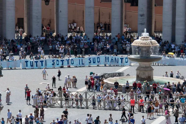 Pilgrims in St. Peter's Square held up a long banner inviting everyone to place themselves “under the mantle” of the Blessed Virgin Mary. Vatican Media