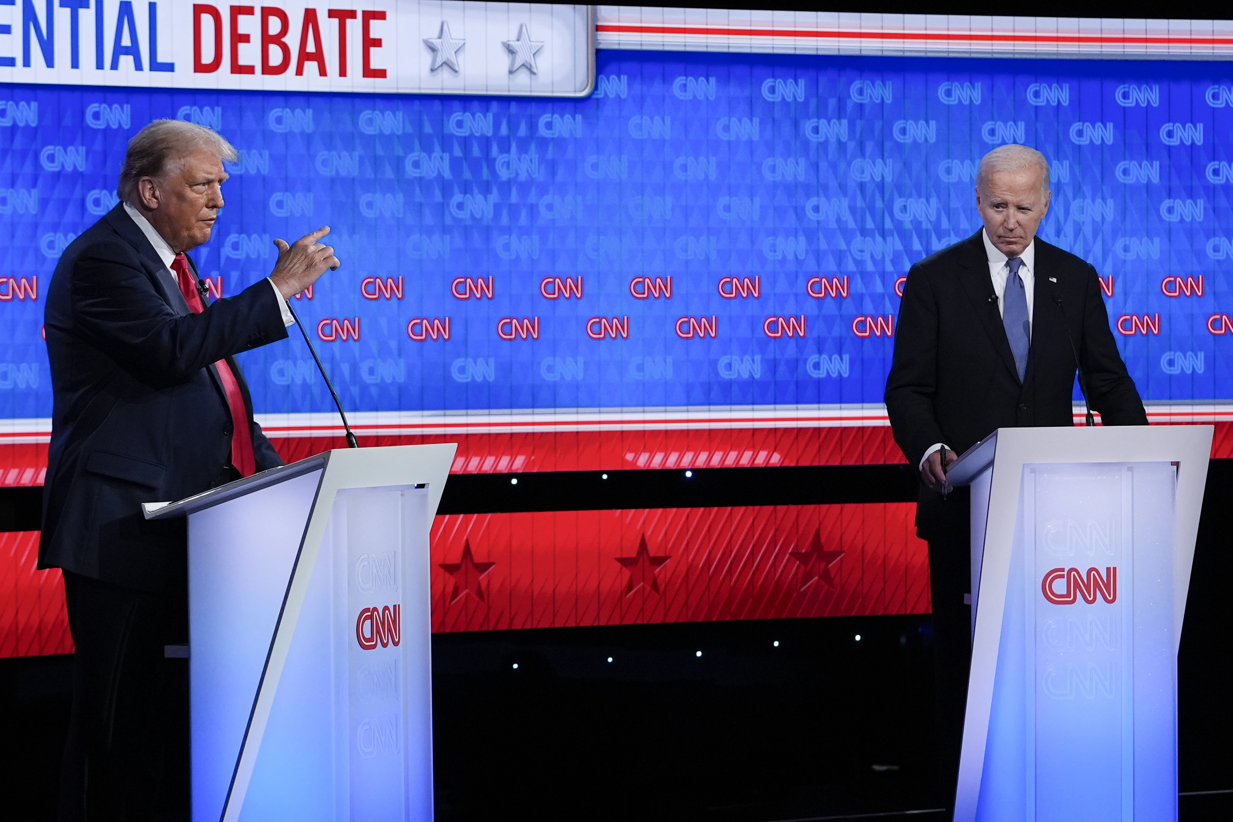 President Joe Biden, right, listens as Republican presidential candidate former President Donald Trump speaks during a presidential debate hosted by CNN, Thursday, June 27, 2024, in Atlanta.?w=200&h=150
