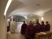 Archbishop Georg Gänswein celebrates Mass in the Vatican crypt close to the tomb of Pope Benedict XVI on Jan. 31, 2023, to mark one month since the death of the pope emeritus on Dec. 31, 2022.