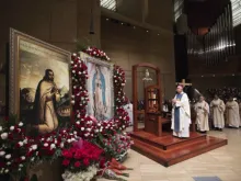 Archbishop Jose Gomez of Los Angeles venerates an image of Our Lady of Guadalupe at the Catheral of Our Lady of the Angels, Dec. 12, 2017.