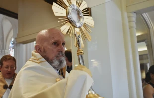 Archbishop Samuel Aquila carries the Eucharist out of the Cathedral Basilica of the Immaculate Conception in Denver on June 9, 2024. Credit: Kate Quiñones/CNA