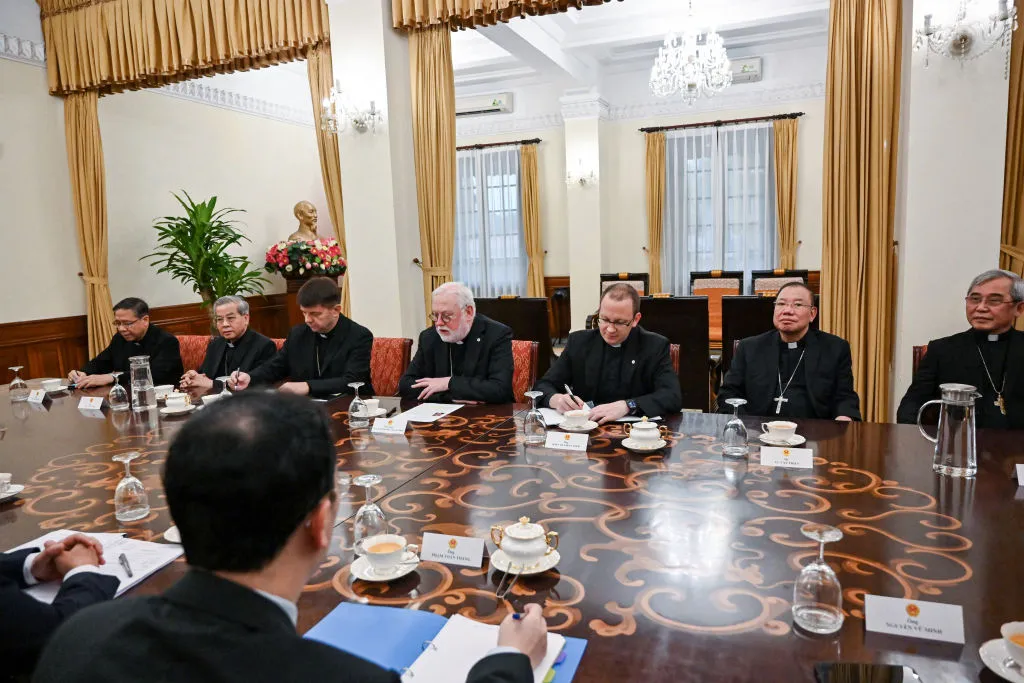 Vatican Secretary for Relations with States Archbishop Paul Gallagher (center) meets with Vietnamc’s Foreign Minister Bui Thanh Son (unseen) and other officials at the Foreign Ministry in Hanoi on April 9, 2024.?w=200&h=150