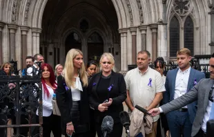 Hollie Dance (center left) and Paul Battersbee (center right)), the mother and father of Archie Battersbee, speak to the media as they leave the Royal Courts of Justice on June 29, 2022 in London, England. Archie's parents ultimately lost their legal fight to keep their son on life support. He died on Aug. 6, 2022. Carl Court/Getty Images