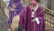 Archbishop Allen H. Vigneron imposes ashes during Ash Wednesday Mass on Feb. 14, 2024, at St. Aloysius Parish in downtown Detroit. Archbishop Vigneron encouraged Catholics to think of this Lenten season as a military campaign proclaiming the kingdom of Christ.