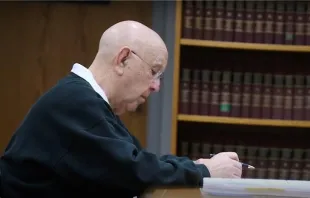 Father Vincent Delorenzo pleaded guilty April 25, 2023, to sexually abusing a 5-year-old boy in 1987. Credit: YouTube/MLive,  Feb. 6, 2020