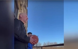 Father Jarett Konrade, pastor of St. John the Baptist Roman Catholic Church in Beloit, Kansas, made an impressive basketball shot during a fundraiser and the moment was the Image of the Week on “EWTN News In Depth.” Credit: “EWTN News In Depth”