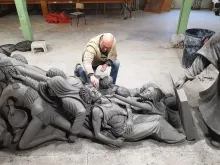 Timothy P. Schmalz with his sculpture ‘Let the Oppressed Go Free.’