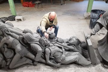Timothy P. Schmalz with his sculpture ‘Let the Oppressed Go Free.’