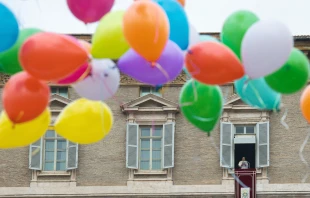 Children participating in a Catholic Action initiative helped to release colorful balloons at the end of the Angelus on Jan. 30, 2022. Vatican Media