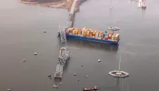 In an aerial view, cargo ship Dali is seen after running into and collapsing the Francis Scott Key Bridge on March 26, 2024, in Baltimore.