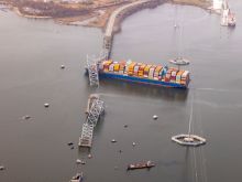 In an aerial view, cargo ship Dali is seen after running into and collapsing the Francis Scott Key Bridge on March 26, 2024, in Baltimore.