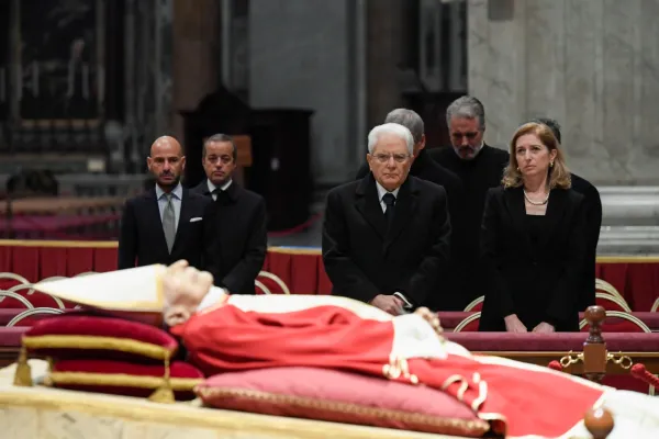 Italian President Sergio Mattarella (first row, second from right) and his daughter Laura Mattarella, Italy's First Lady, pay their respects to Pope Emeritus Benedict XVI, whose body lies in state in St. Peter's Basilica in Rome, on Jan. 2, 2023. Vatican Media
