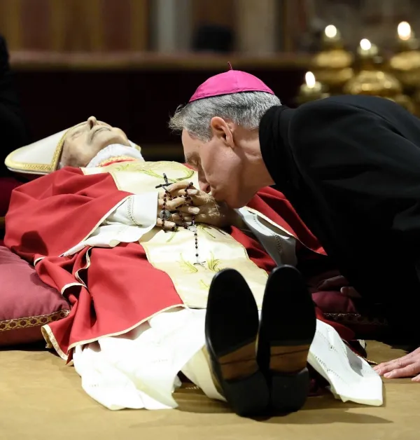 Archbishop Georg Gänswein, personal secretary to Pope Benedict XVI, bids farewell to the late pontiff while his body lays in state at St. Peter's Basilica. Vatican Media