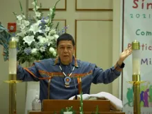 Michael Madrigal, a lay minister in the Diocese of San Bernardino, recites the “Native American Prayer to the Four Directions” at the beginning of the diocese’s opening Mass for the Synod on Synodality, Oct. 17, 2021 at Holy Angels Church in Riverside, California.