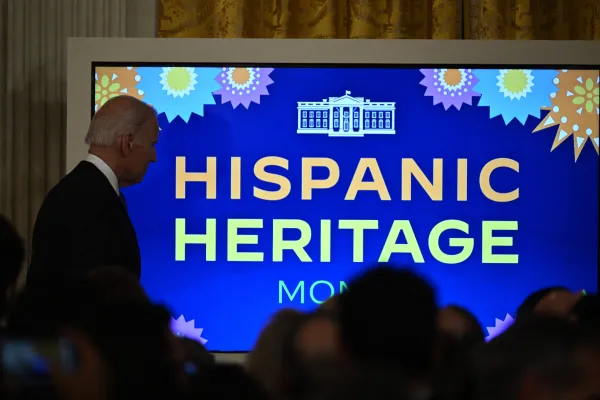 President Joe Biden walks past a screen during a Hispanic Heritage Month reception in the East Room of the White House in Washington, D.C., on Sept. 30, 2022. Brendan Smialowski/AFP via Getty Images