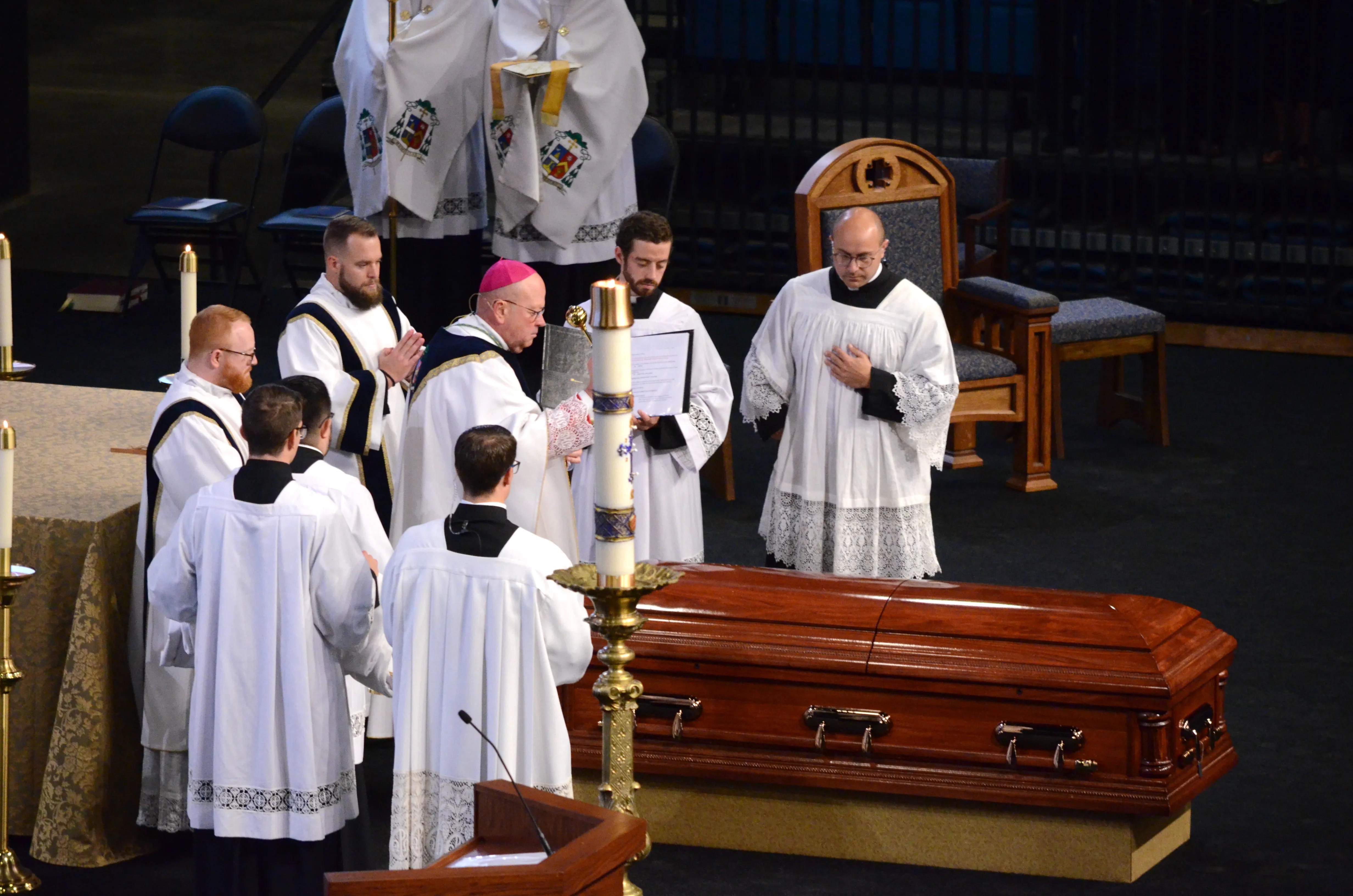 Bishop Carl Kemme of Wichita performs the absolution over the coffin of Fr. Emil Kapaun after his funeral Mass at Hartman Arena in Park City, Kan., Sept. 29, 2021.?w=200&h=150
