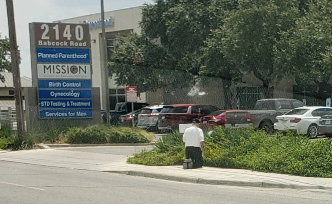 Bishop Emeritus Michael Pfeifer of San Angelo, Texas, prays in front of a Planned Parenthood facility.?w=200&h=150