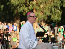 Bishop Robert Barron speaks to tens of thousands of young people at a World Youth Day gathering in Lisbon, Portugal, Aug. 2, 2023. The event, hosted by the U.S. bishops’ conference, culminated in a eucharistic procession and Holy Hour.