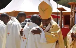 Father Michael Mithamo King’ori embraces Archbishop Anthony Muheria during his Jan. 14, 2023, ordination Mass. Credit: Nyeri Archdiocese
