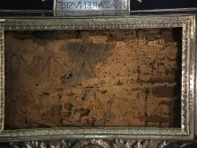 The Titulus Crucis, the title panel of the True Cross on which Jesus was crucified. Written in Latin and Greek, it says "Jesus the Nazarene King of the Jews."