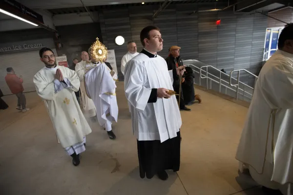 Brooklyn Bishop Robert Brennan carries the Blessed Sacrament and monstrance during a Eucharistic procession at Louis Armstrong Stadium on April 20, 2024. Credit:: Jeffrey Bruno