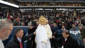 Brooklyn Bishop Robert Brennan leads a Eucharistic procession inside a packed Louis Armstrong Stadium in Brooklyn, New York, on April 20, 2024.