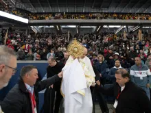 Brooklyn Bishop Robert Brennan leads a Eucharistic procession inside a packed Louis Armstrong Stadium in Brooklyn, New York, on April 20, 2024.