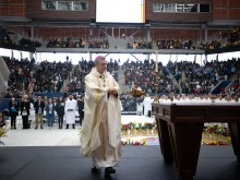 Brooklyn Bishop Robert Brennan carries the thurible around the altar inside Louis Armstrong Stadium on April 20, 2024.