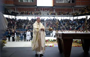 Brooklyn Bishop Robert Brennan carries the thurible around the altar inside Louis Armstrong Stadium on April 20, 2024. Credit: Jeffrey Bruno