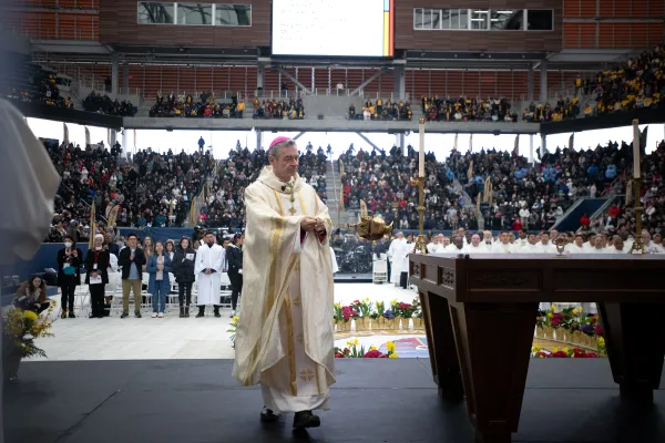 Brooklyn Bishop Robert Brennan carries the thurible around the altar inside Louis Armstrong Stadium on April 20, 2024. Credit: Jeffrey Bruno