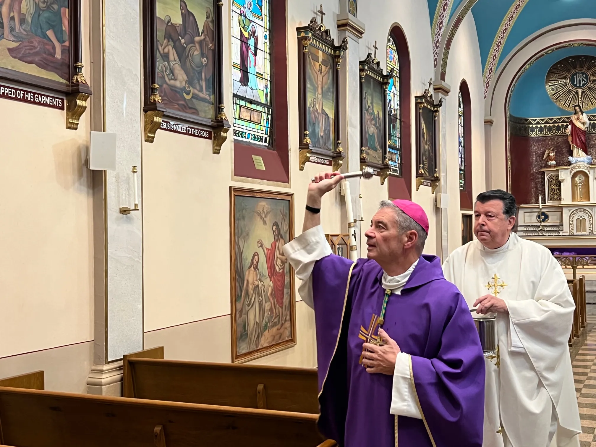 Bishop Robert Brennan blesses Annunciation of the Blessed Virgin Mary Church in Brooklyn, New York, with holy water on Nov. 4, 2023, in response to the filming of an indecent music video in the church. Assisting the bishop is Monsignor Joseph Grimaldi, vicar general of the Diocese of Brooklyn.?w=200&h=150