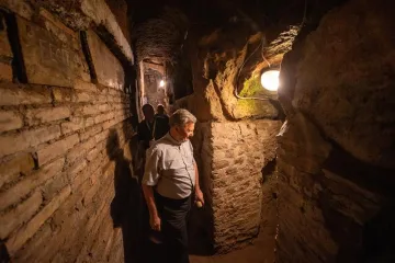 Touring catacombs of St. Sebastian