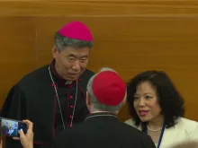 Shanghai Bishop Shen Bin speaks to Vatican Secretary of State Cardinal Pietro Parolin at a Vatican conference on Wednesday, May 22, 2024.