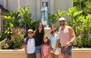 The Cardenas family, of Sacramento, posing outside Maria Lanakila Catholic Church in Lahaina, Hawaii. Angel Cardenas