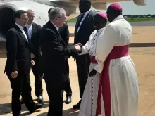Archbishop Stephen Ameyu Martin receives Cardinal Pietro Parolin upon the cardinal’s arrival in Juba, South Sudan, Aug. 14, 2023.