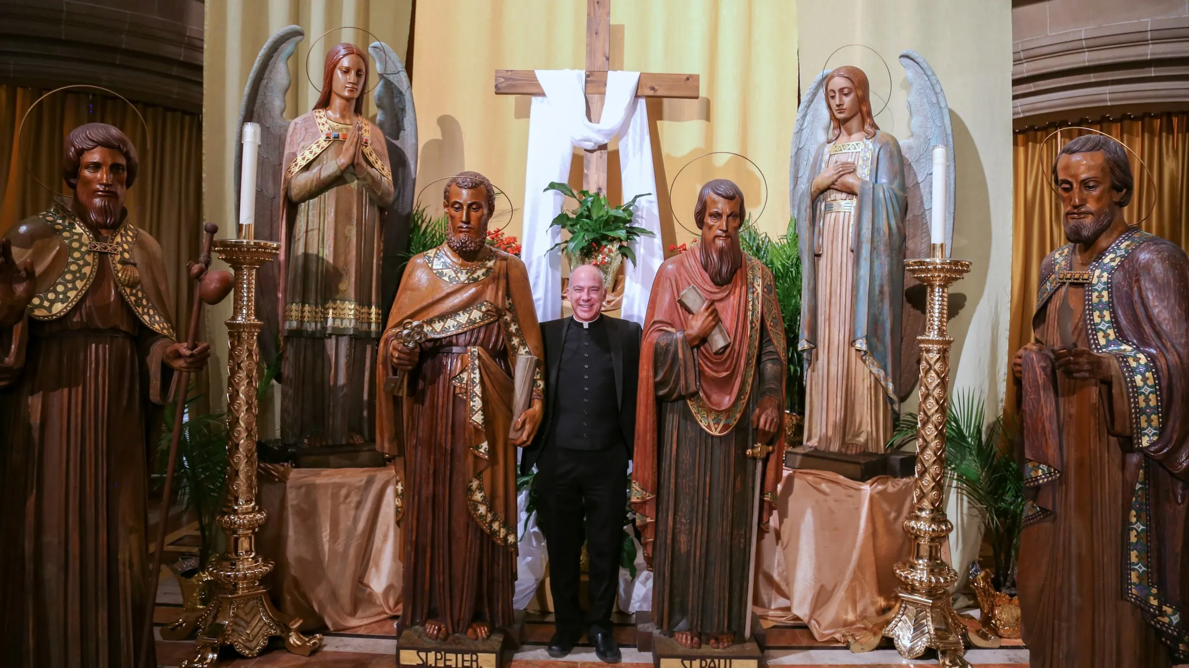 Father J.J. Mech, rector of the Cathedral of the Most Blessed Sacrament in Detroit, stands next to the life-sized statues of the apostles that have now been installed in the cathedral's worship space, along with first-class relics of each apostle. The "Journey with the Saints" pilgrimage, which will be dedicated Feb. 8, 2024, in a special ceremony with Archbishop Allen H. Vigneron, is part of the cathedral's ongoing transformation into an "apostolic center for the arts and culture."?w=200&h=150