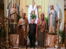 Father J.J. Mech, rector of the Cathedral of the Most Blessed Sacrament in Detroit, stands next to the life-sized statues of the apostles that have now been installed in the cathedral's worship space, along with first-class relics of each apostle. The "Journey with the Saints" pilgrimage, which will be dedicated Feb. 8, 2024, in a special ceremony with Archbishop Allen H. Vigneron, is part of the cathedral's ongoing transformation into an "apostolic center for the arts and culture."