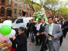 Faithful Catholics hold a procession in New York to honor the Virgin of the Clouds, venerated in Ecuador and Peru.