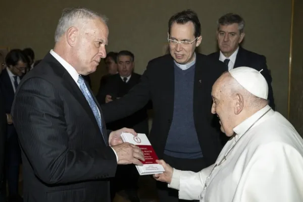 Deacon Ed Shoener President of CMHM, presents Pope Francis with the book 