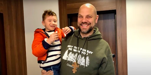 Father Jason Charron with an orphan from Ukraine.?w=200&h=150