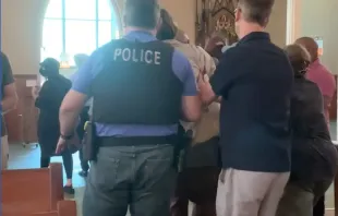 Pro-abortion protesters are escorted from Mass at St. Joseph Catholic Church in Chicago, June 26, 2022. Screengrab of instagram video posted by troubleinthechi.