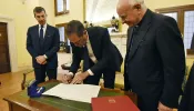 Chuck Robbins, the chief executive of the multinational digital communications conglomerate Cisco, signs the Rome Call for AI Ethics, a document by the Pontifical Academy for Life, on April 24, 2024, at the Vatican.