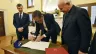 Chuck Robbins, the chief executive of the multinational digital communications conglomerate Cisco, signs the Rome Call for AI Ethics, a document by the Pontifical Academy for Life, on April 24, 2024, at the Vatican.