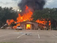 Queen of the Holy Rosary Catholic Church in Hostyn, Texas, is shown on fire on June 9, 2022.